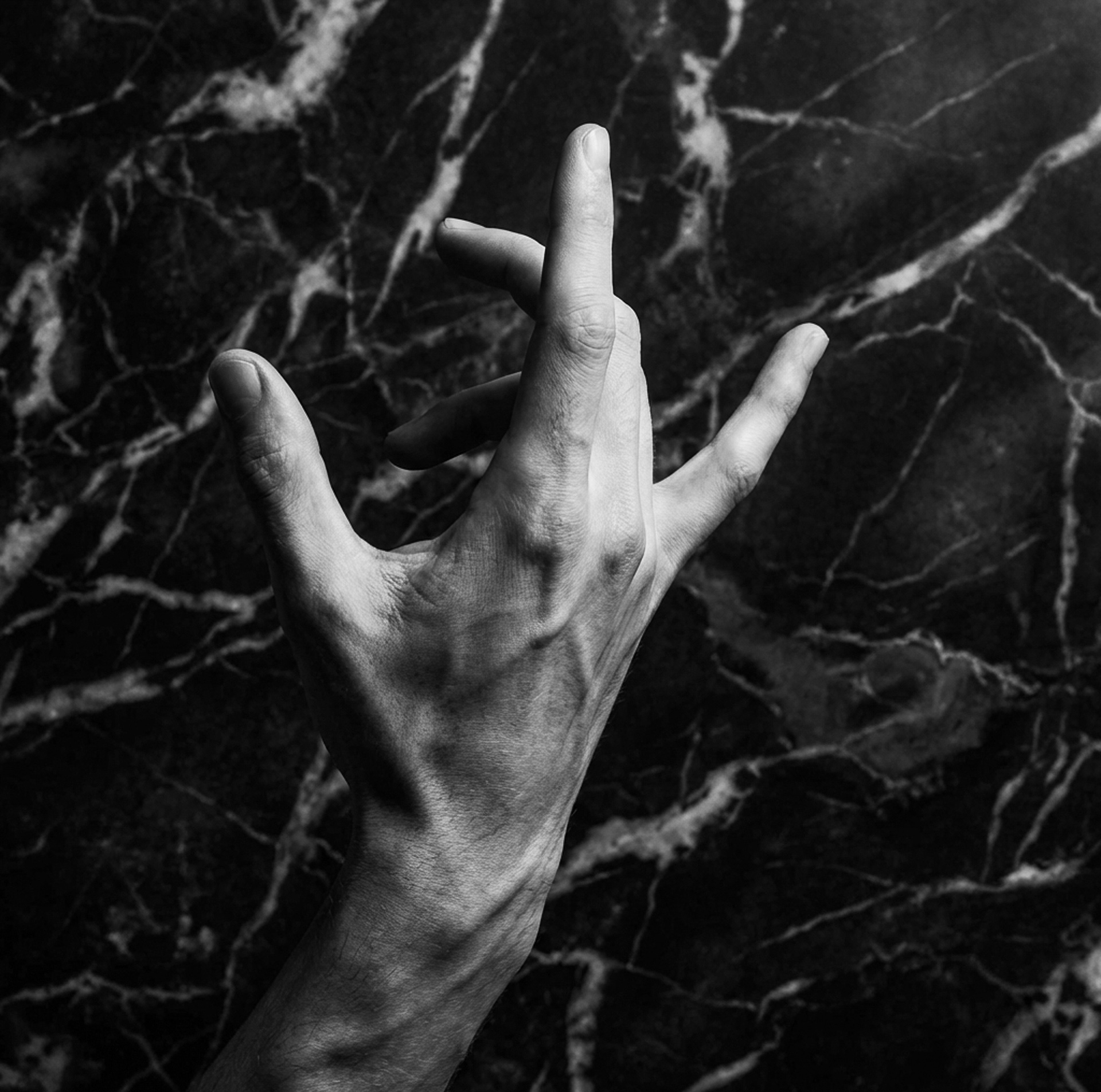 Hand gesture in front of faux marble